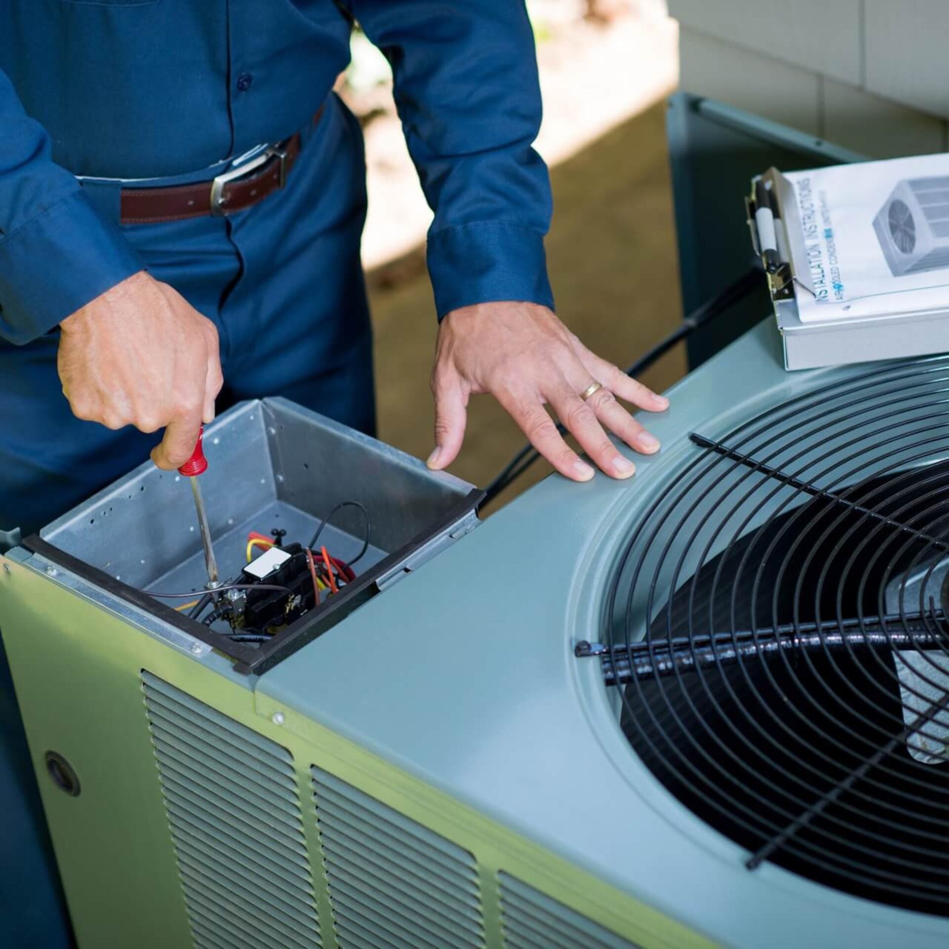 HVAC Technicains inspecing HVAC unit in Texas