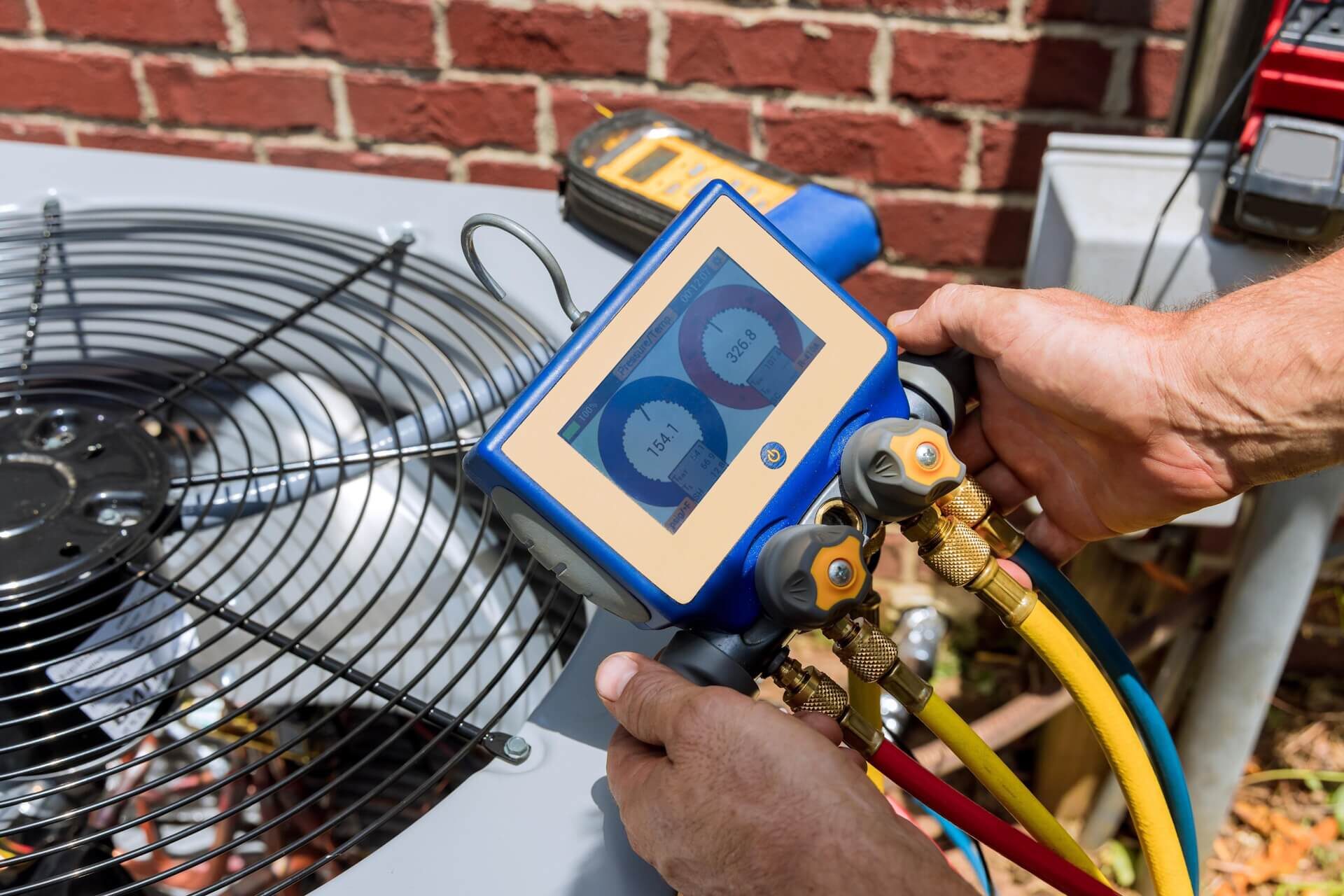 HVAC Technician Conduction Routine Maintenance