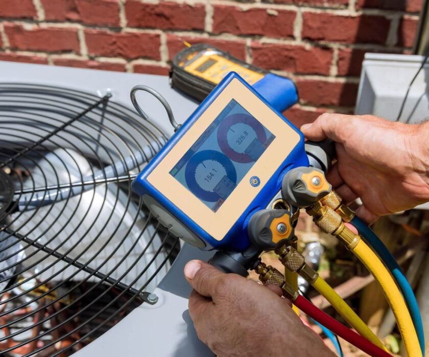 HVAC Technician Conduction Routine Maintenance